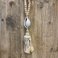 Beads with macrame tassel and whole shell Close up