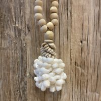 Shell and beads curtain tie back Close up